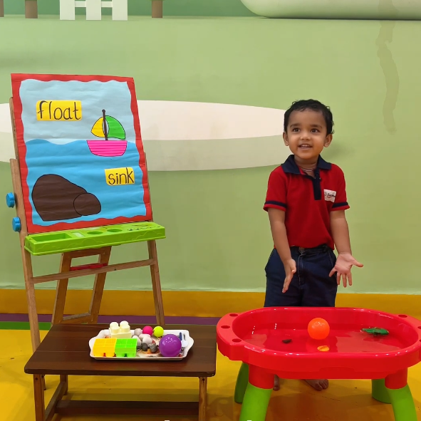 Child at a float-and-sink science table